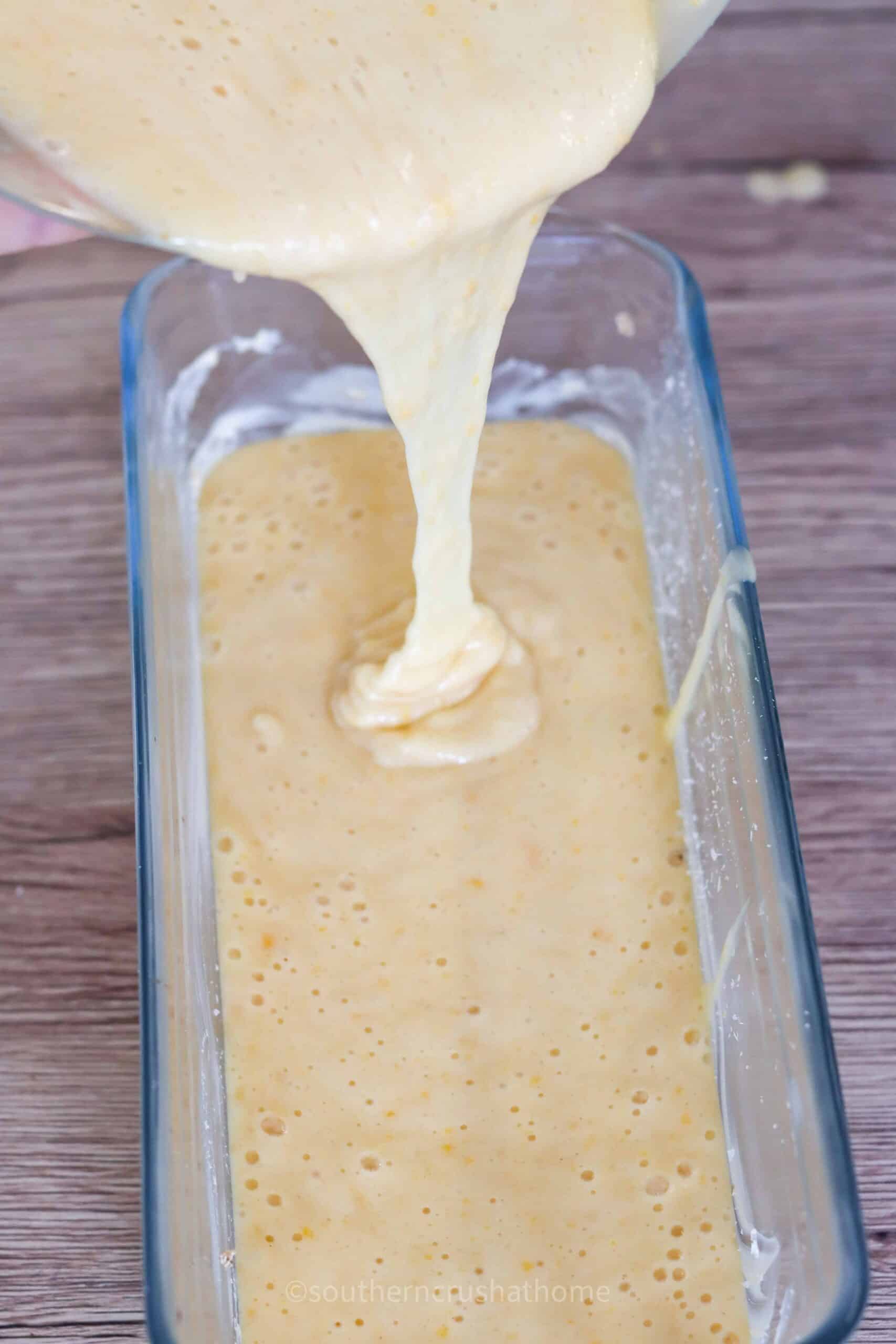 pouring batter in loaf pan