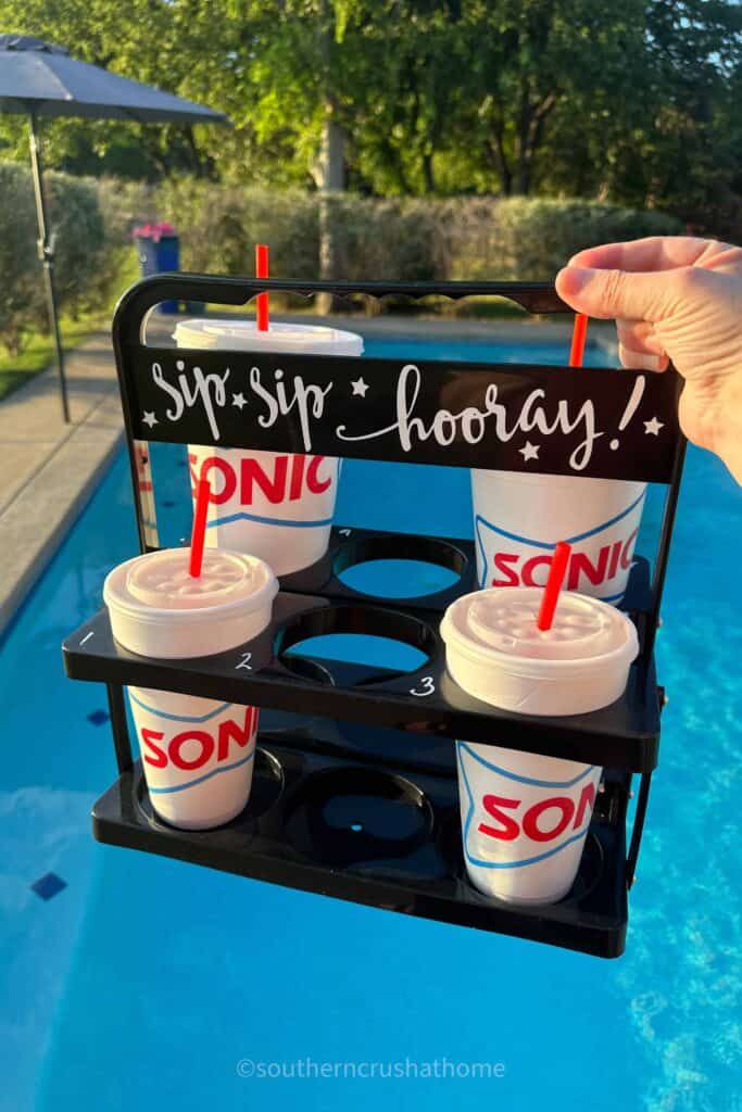 drink carrier with sonic drinks over the pool