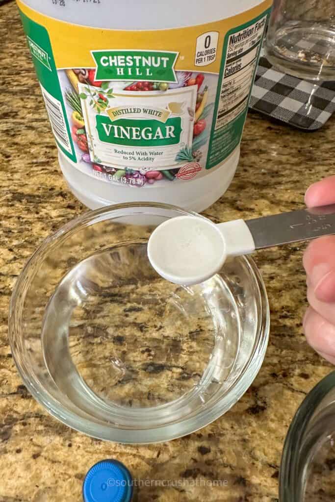 adding teaspoon of white vinegar