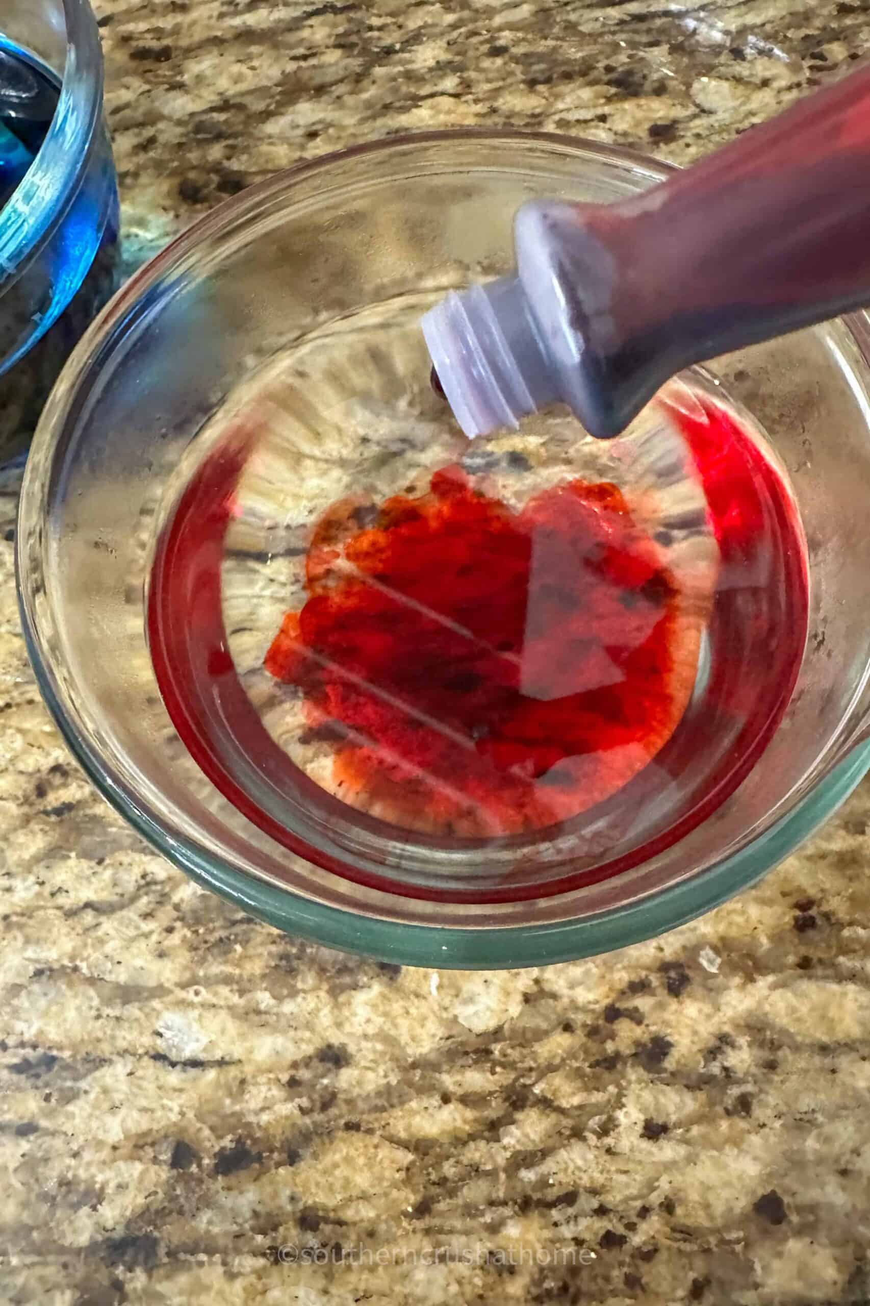 adding red food coloring