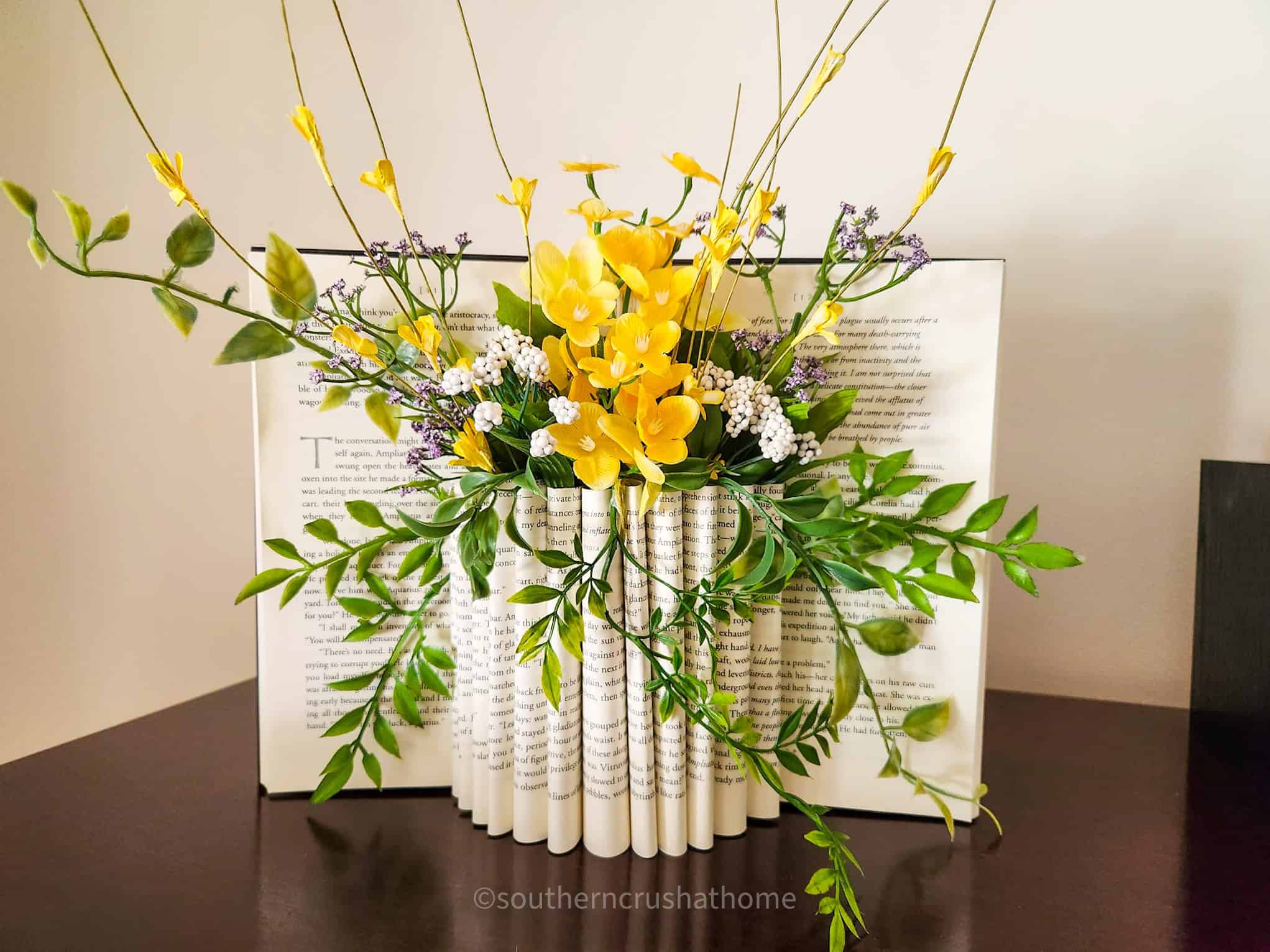 yellow flowers book page flower vase