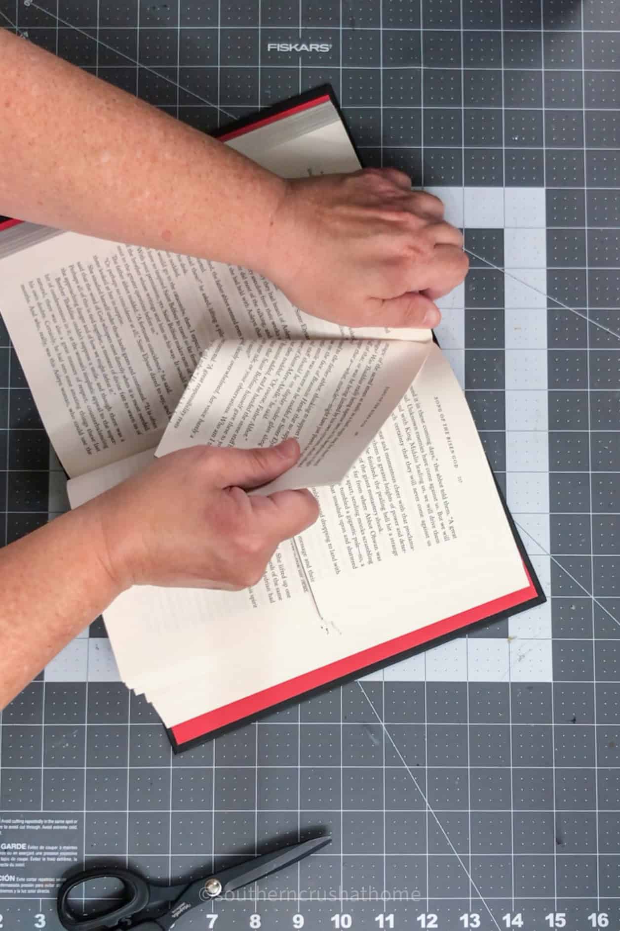 tearing book pages at the top half