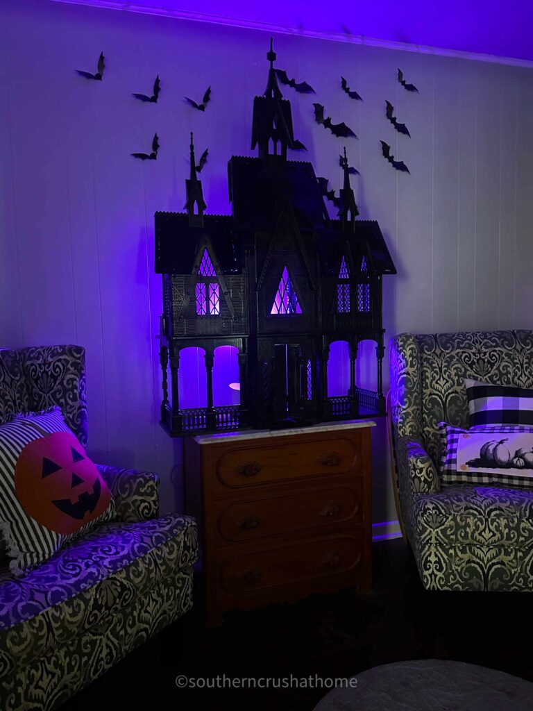 black spray painted frozen castle haunted doll house