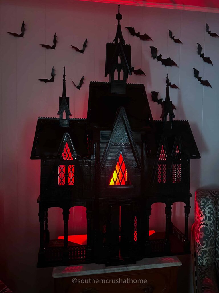 red lighted frozen castle haunted doll house