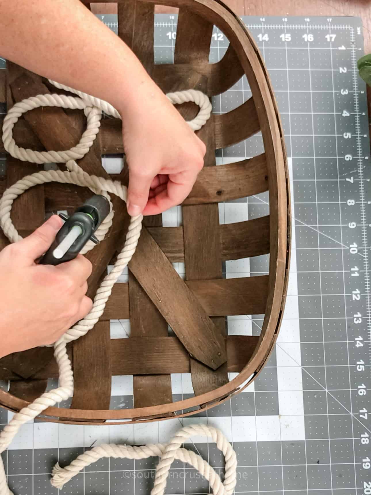 gluing down nautical rope into the word boo