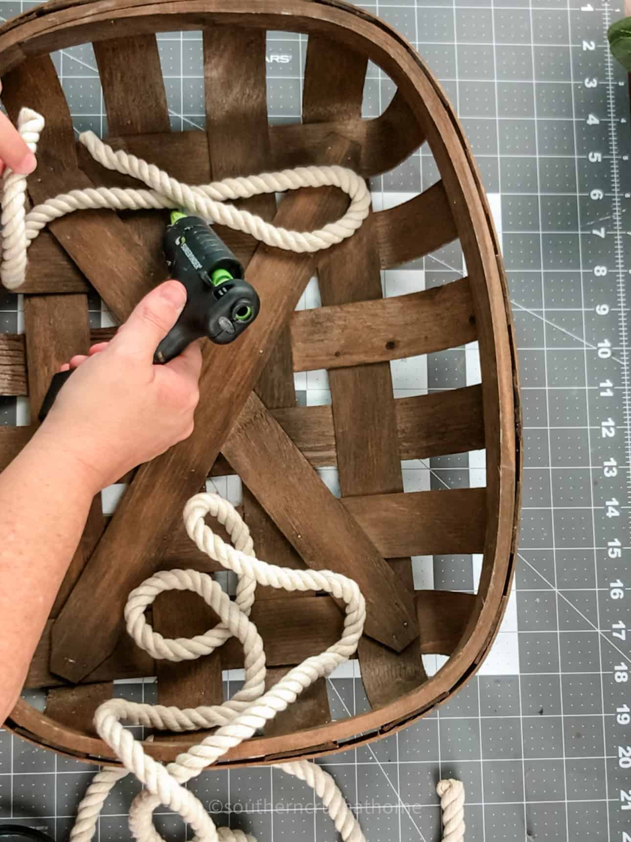 gluing down nautical rope into the word boo