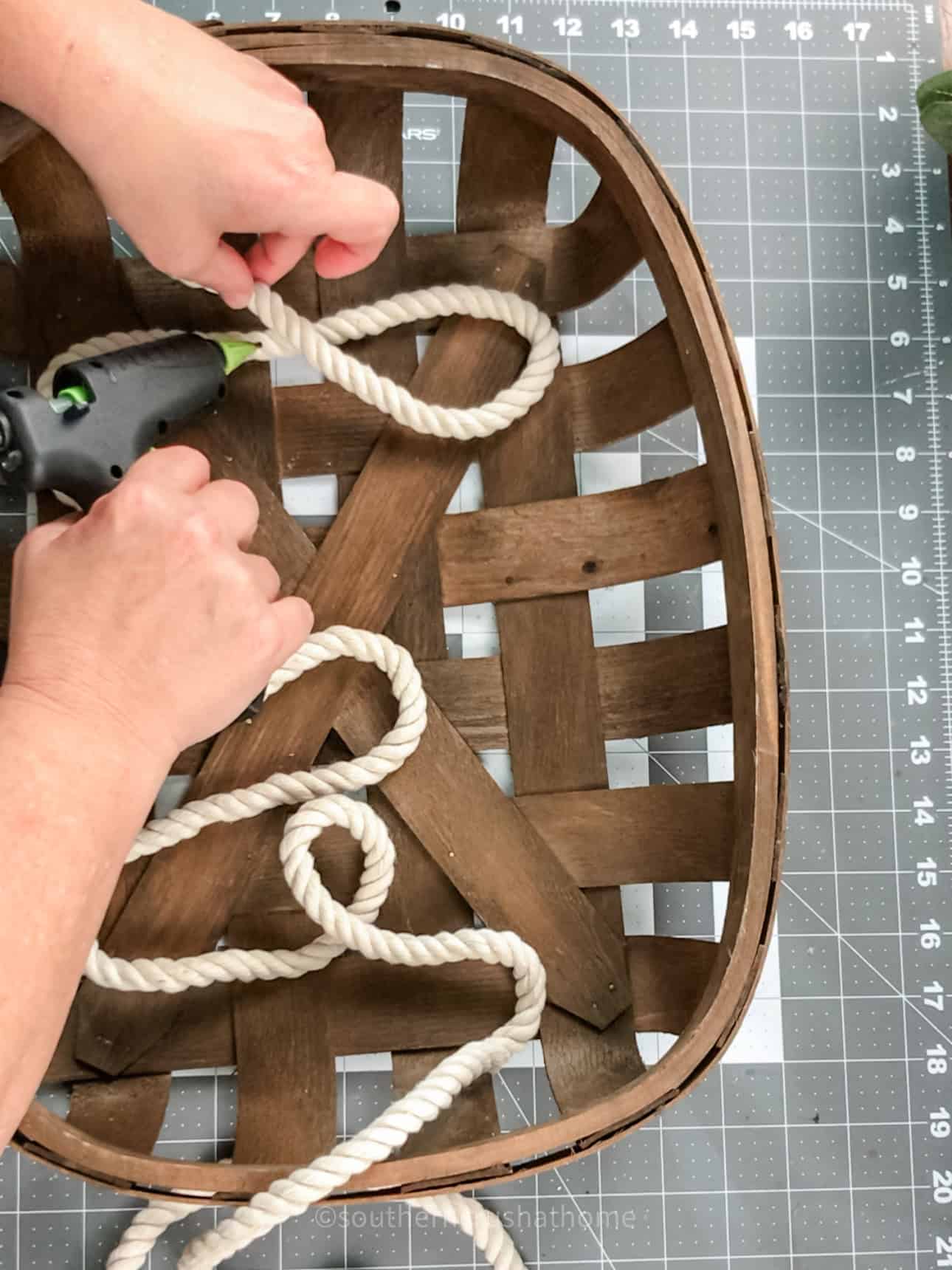 gluing down nautical rope into the word boo