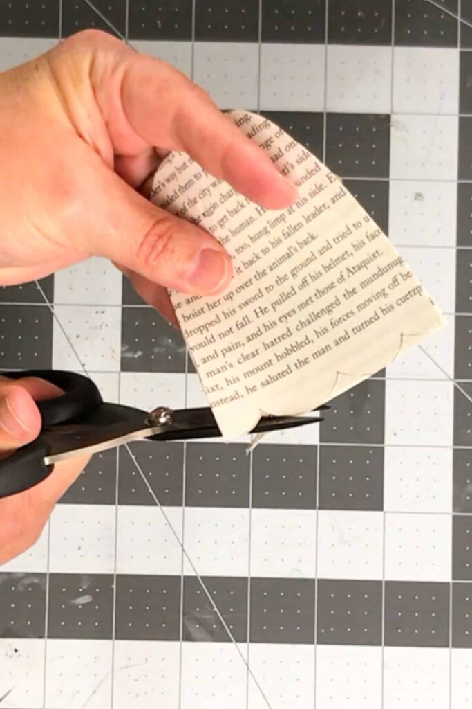 cutting a ghost out of a book page