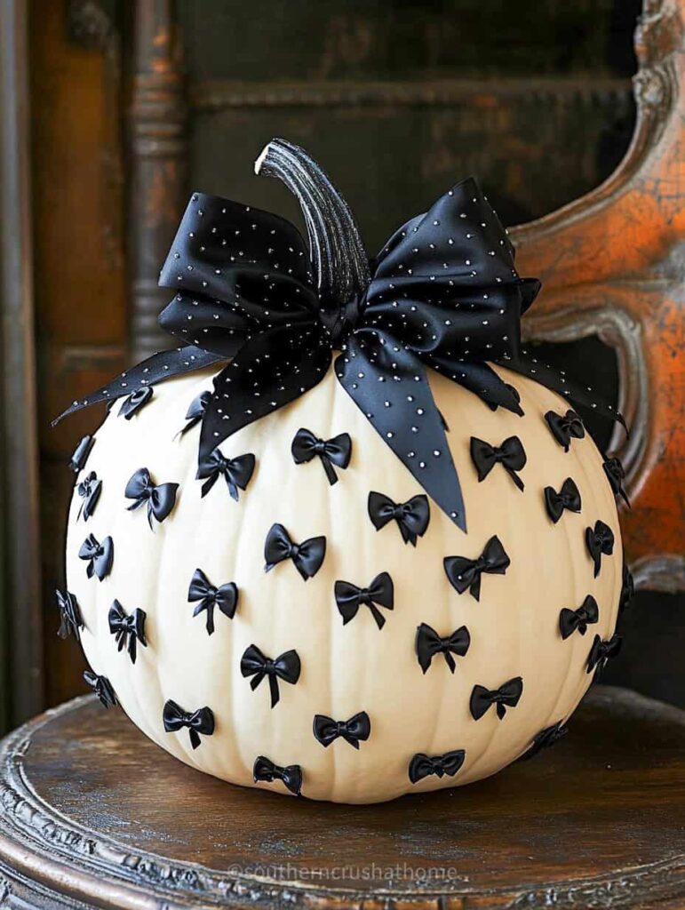 tiny black bows on white pumpkin