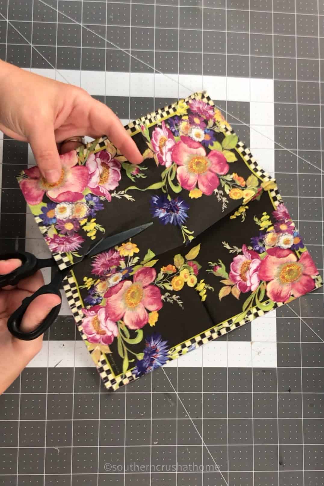 cutting out florals from paper napkins