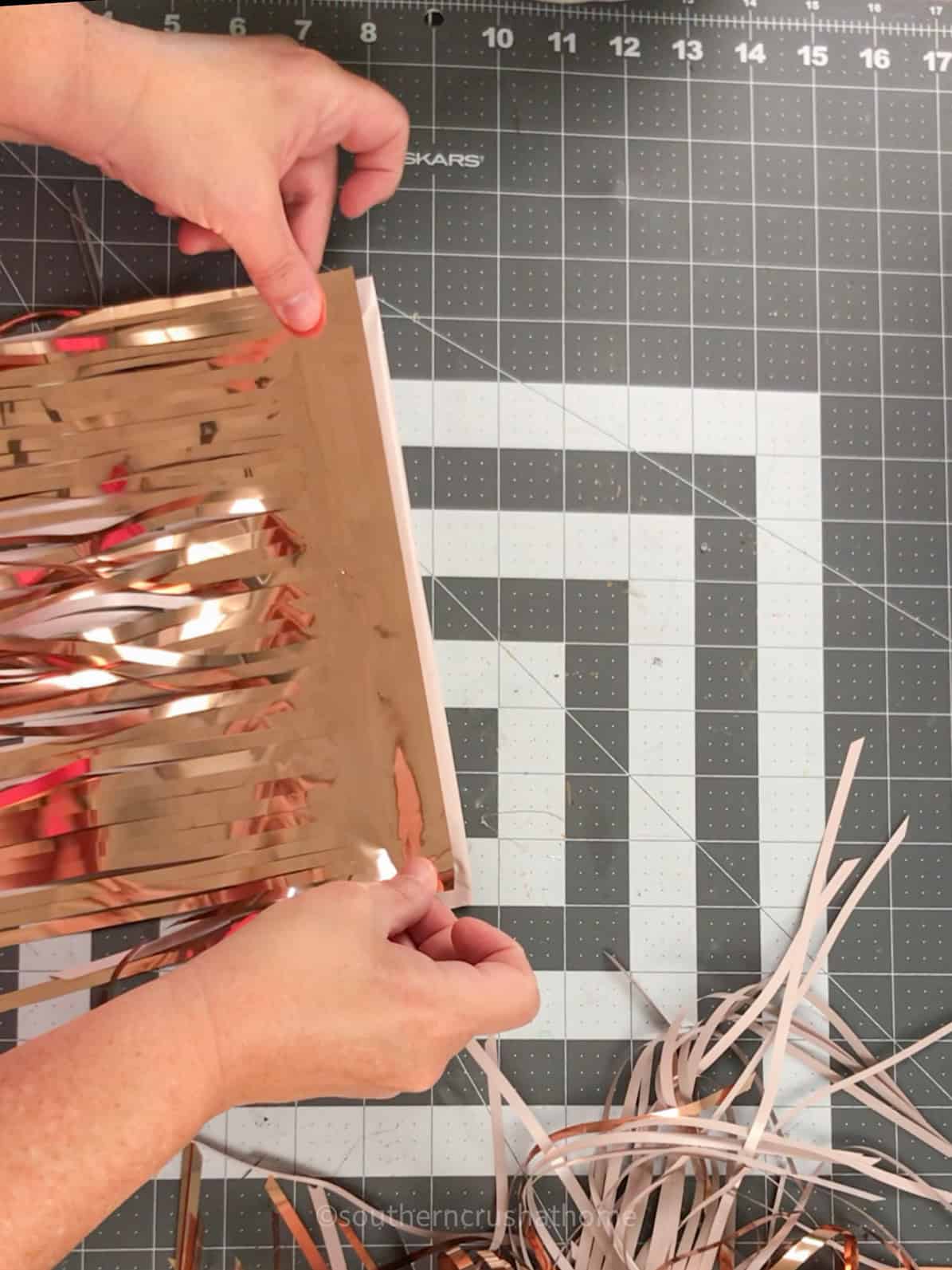 adding rose gold mylar fringe to pink layer