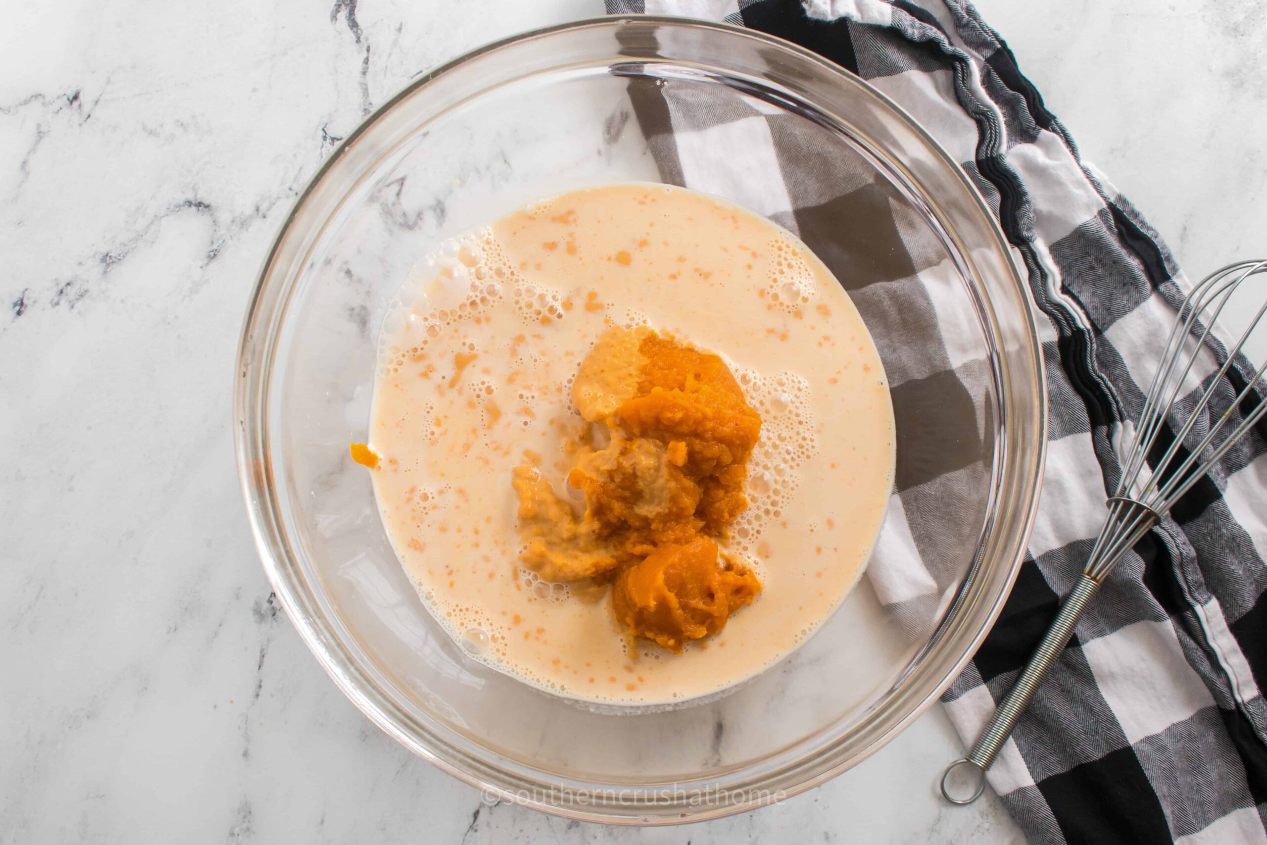 bowl with ingredients for pumpkin dump cake recipe