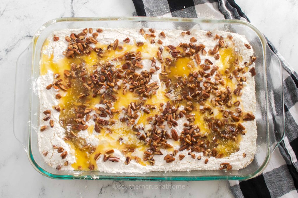 adding melted butter to dump cake