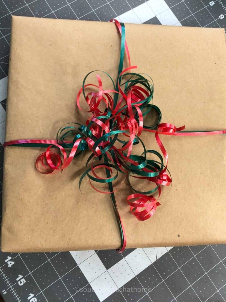 curling ribbon bow on gift wrapping