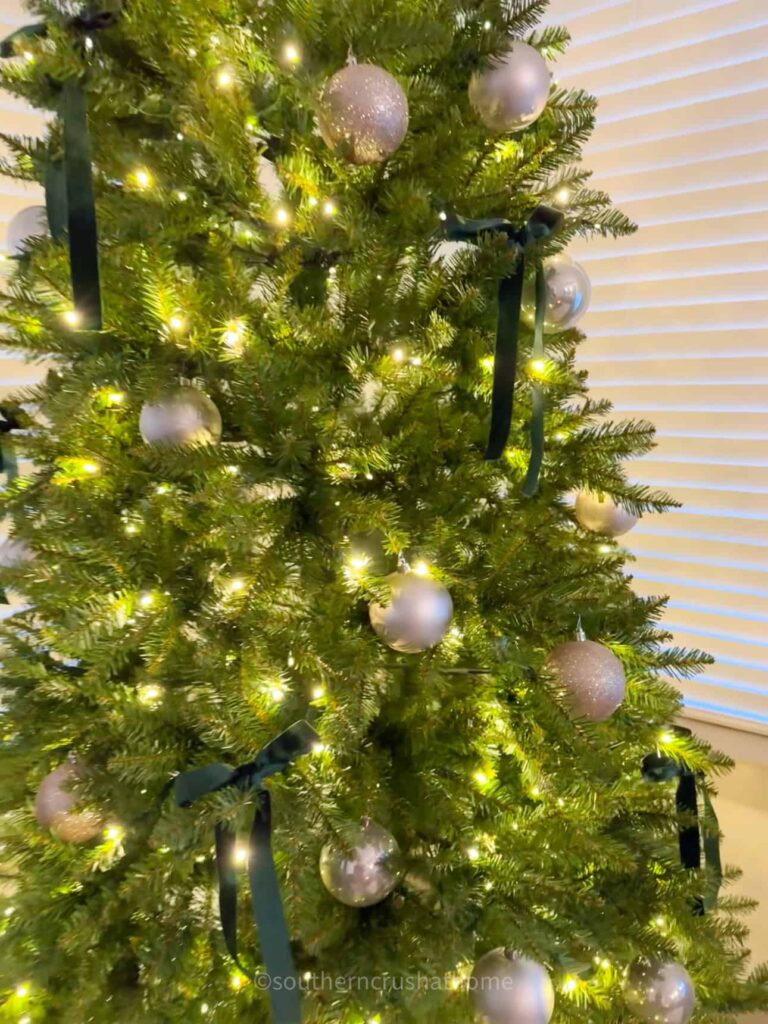 side view of christmas tree lit and decorated