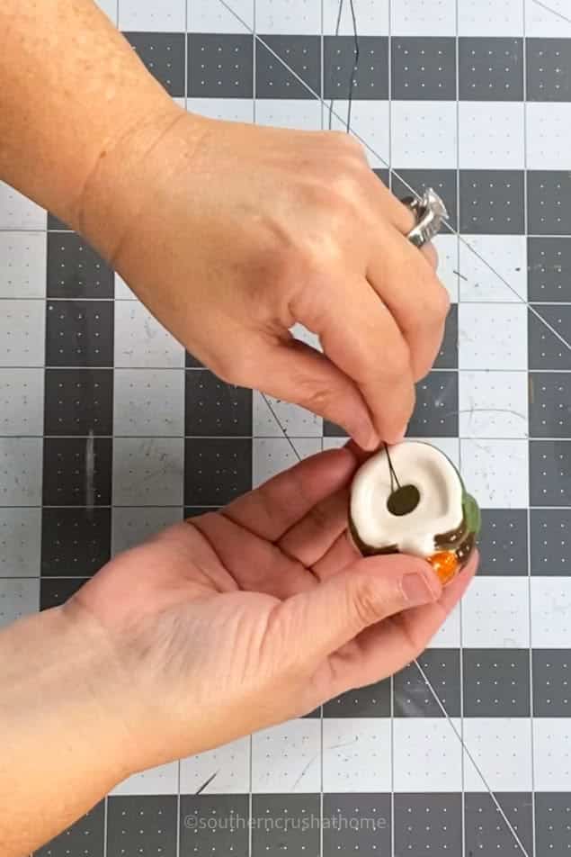 threading floral wire through salt shaker