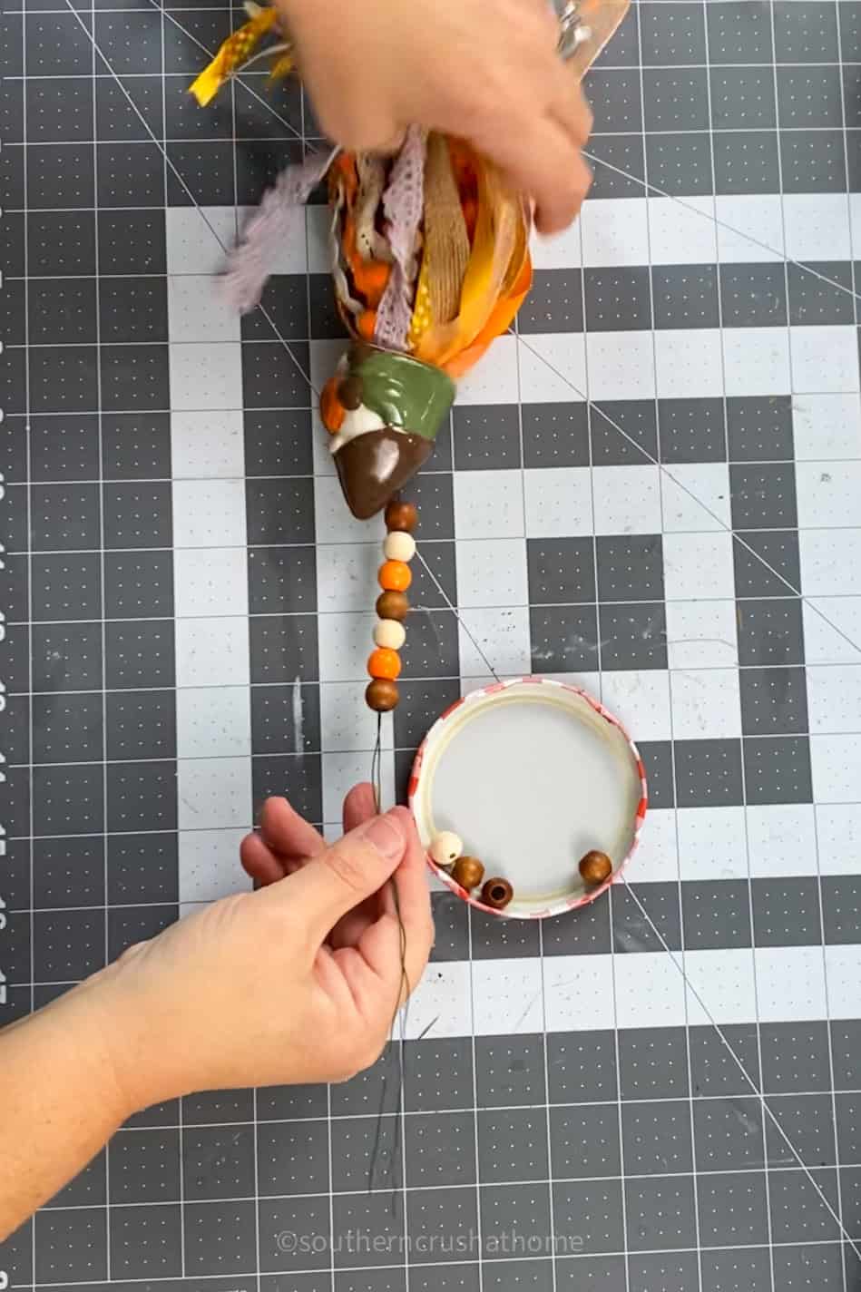 adding wood beads to tassel