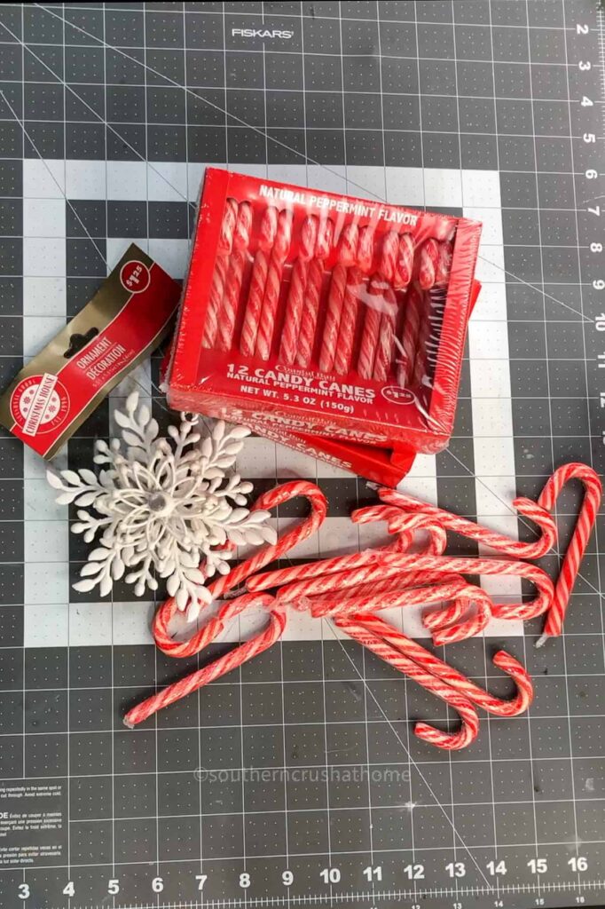 candy canes and snowflake ornament from dollar tree for candy cane wreath