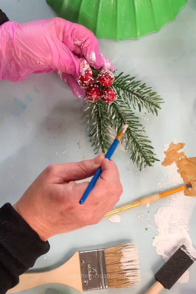 painting white on greenery for ornament topper