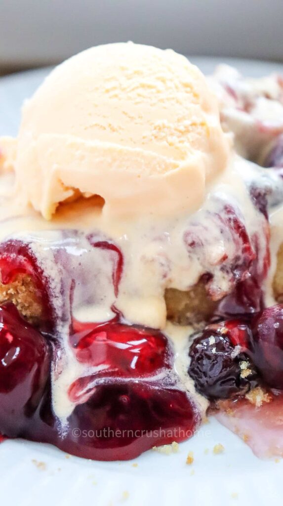 cherry dump cake with ice cream on top