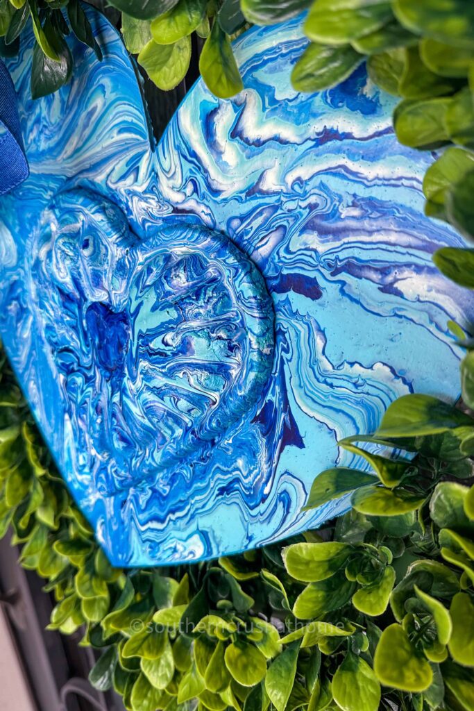 up close of blue acrylic pour painting